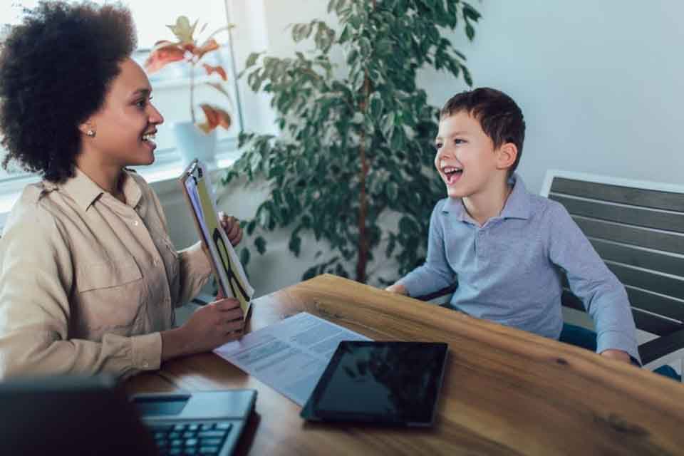 A special education teacher works with a student.