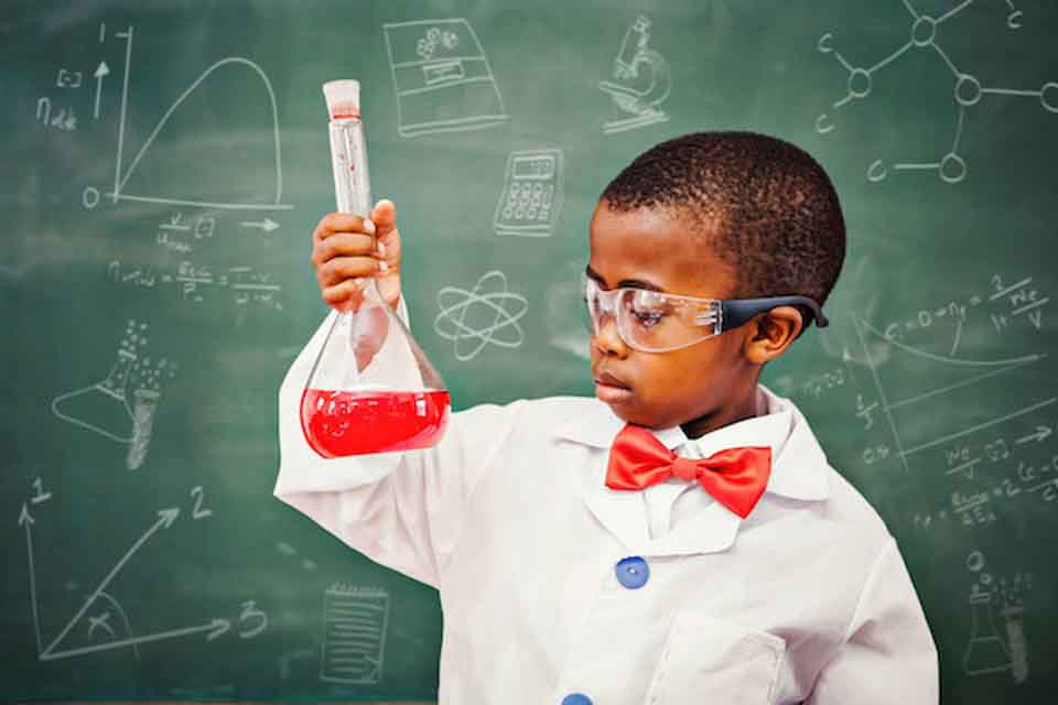 A boy dressed as a chemistry professor
