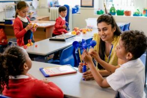 Teacher offering differentiated instruction to students in a classroom.