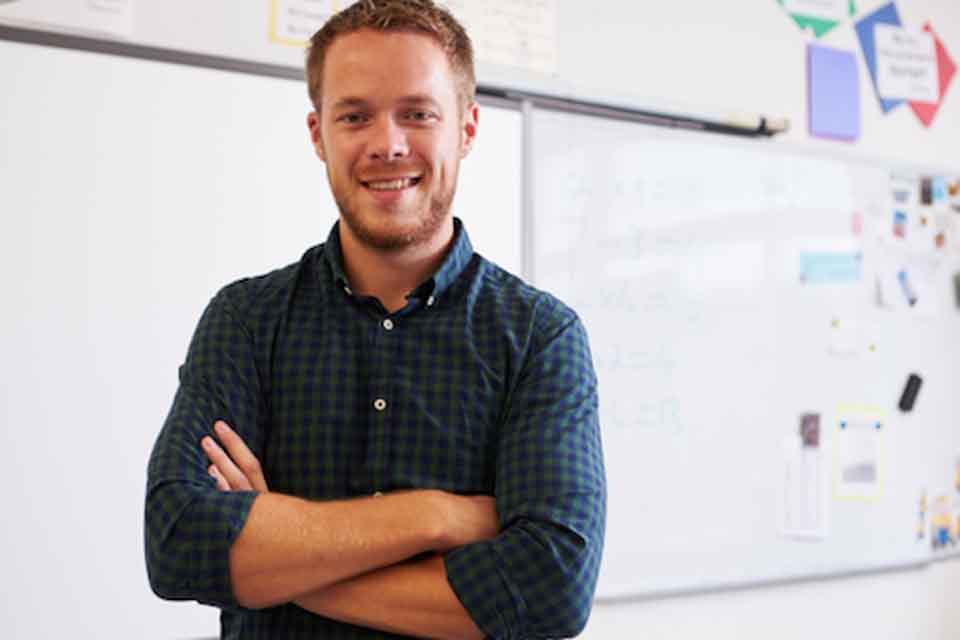 A man with a white board behind him