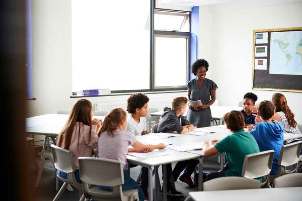 A teacher leads a group discussion.