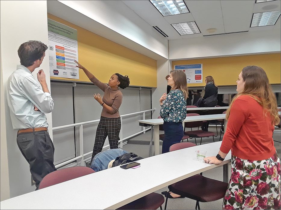 ITEP students present in front of a class during their capstone presentations.