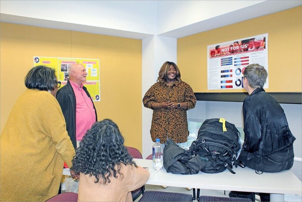 International Training and Education Program (ITEP) graduate students deliver their capstone presentations, hanging their research findings on the wall in poster-form and discussing them with peers and SOE faculty and staff.